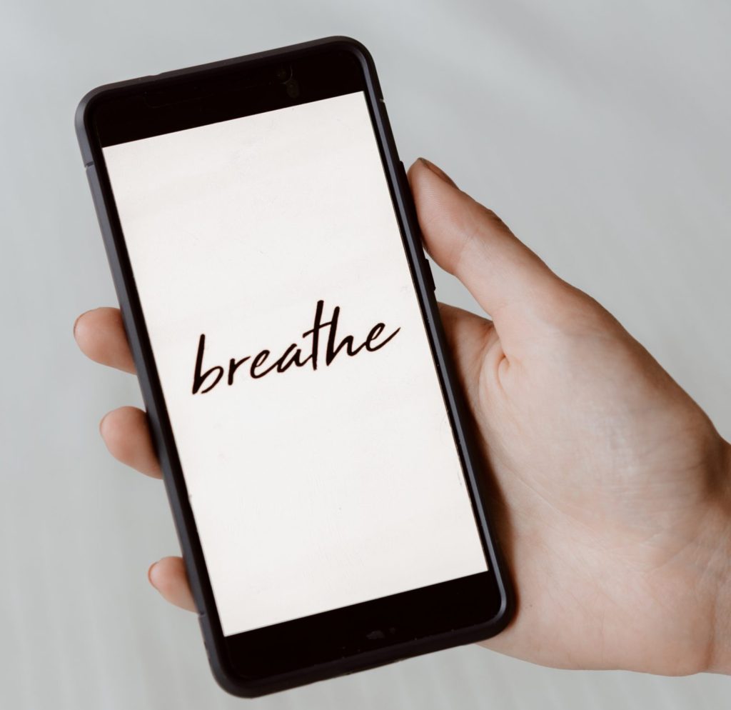 Phone screen showing the word Breathe