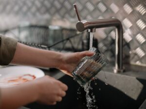 Hands washing dishes- Micro moment in mindfulness
